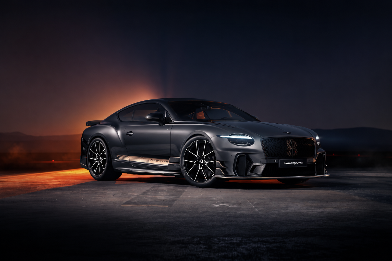 2027 Bentley Supersports in dark metallic finish photographed at dusk with dramatic orange backlighting